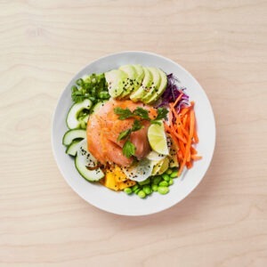 Poké bowl with smoked salmon, avocado, pickled ginger and mango.