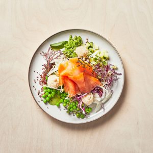 Cold-smoked salmon with celeriac crème, pickled parsley, bean shoots and quinoa.